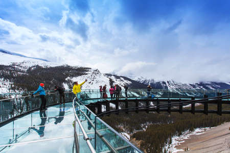 glass boardwalk with winter snow capped mountainsのeditorial素材