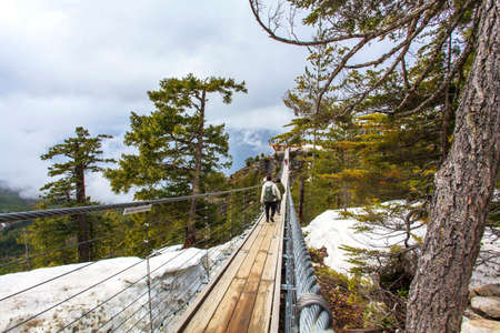 bridge at snow mountainsの写真素材