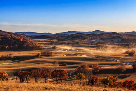 autumn grassland dust mountainsの写真素材