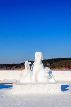Landscape view of a snow sculpture under the blue sky in Anhui city, Chinaのeditorial素材