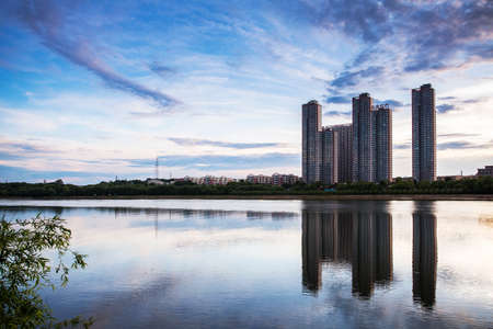 City building with lake sceneryのeditorial素材