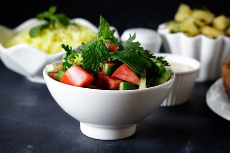 Green salad. Close up on black background. - Imageの写真素材