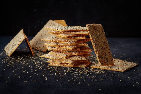 pastry on black background top view. Fresh pastry with datde and Sesame seeds  inside close up. - Imageの写真素材