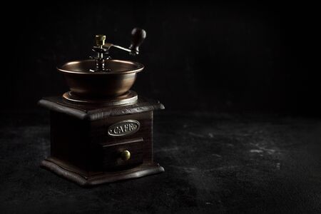 still life old Coffee Grinders on background black. - Imageの写真素材