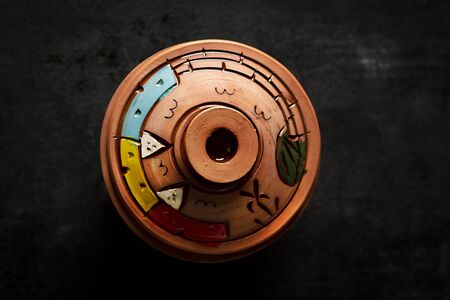 Egyptian pottery. top view on black background - Imageの写真素材