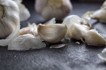 Garlic on wooden background black. - Image