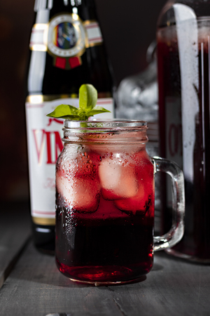 Red fruit juice is the most popular drink in Saudi Arabia and the Gulf, isolated on a black background. - Imageのeditorial素材