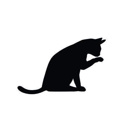 Cat licking its paw isolated on white background. A silhouette cat. Pet animal. Vector stockのイラスト素材