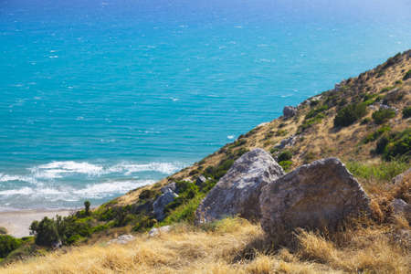 Stones with the sea in the background. View from the hill, Cyprusの写真素材