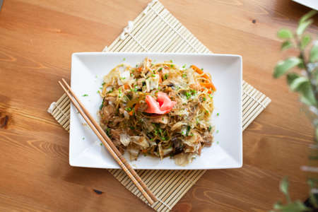 Yakisoba noodles topped with katsuobushi and gingerの写真素材