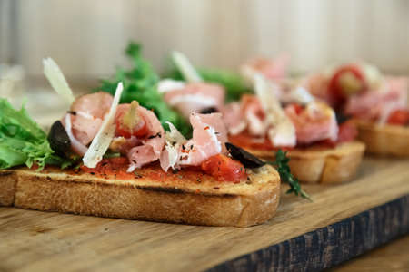 toasted bread slice with smoked ham and cheese.の写真素材