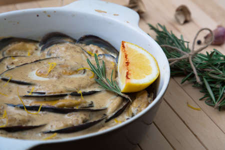 Baked mussels withcream, cheese and citrus, closeupの写真素材