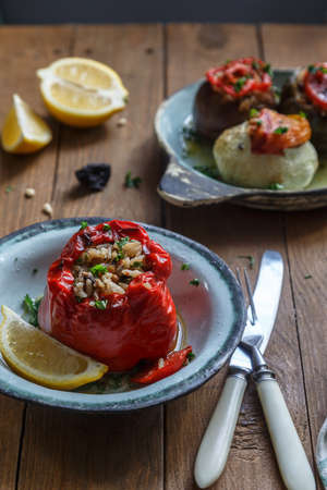 Bell peppers stuffed with meat, rice and sauce on plate, selective focusの写真素材