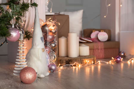 Christmas Decorations with Gingerbread man, lamp with candle and christmas baubles.の写真素材