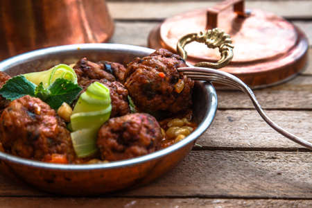 izmir kofte - Turkish traditional meatball with chickpeas. tomato sauce and mintの写真素材