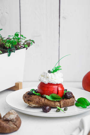 Cretan appetizer dakos. Rusk with feta cheese, tomato, olive oil and olivesの写真素材