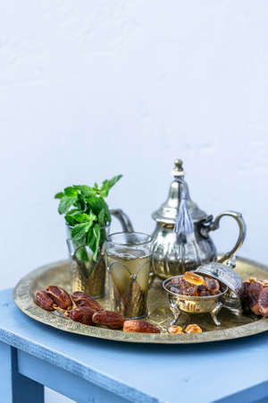 Traditional Moroccan mint tea on white background, selected focusの写真素材