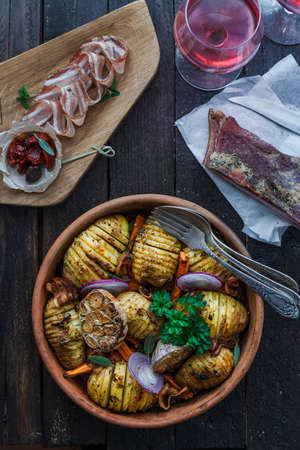 Potatoes with carrots close up in a bowl, vertical, rustic styleの写真素材