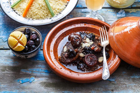 Traditional moroccan tajine of beef and prunes and almonds, close view.