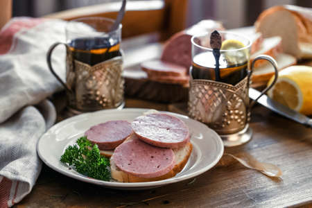 Breakfast with sandwich and teaの写真素材