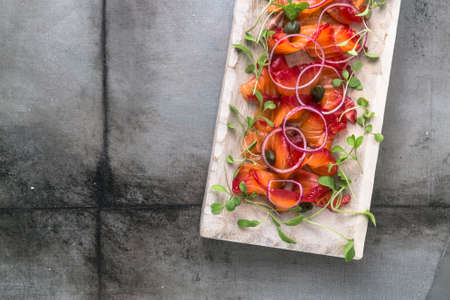 Gravlax - cured in salt and beetroot salmon or trout, copyspaceの写真素材