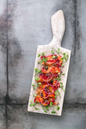 Gravlax - cured in salt and beetroot salmon or trout, copyspace