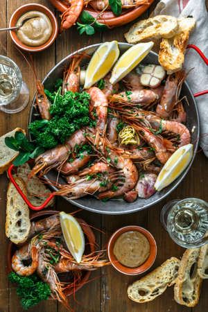 Prawns Shrimps roasted with lemon and garlic in iron pan. Top viewの写真素材