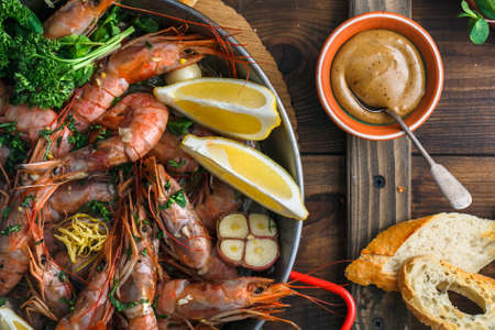 Prawns Shrimps in paella pan, background, top view.