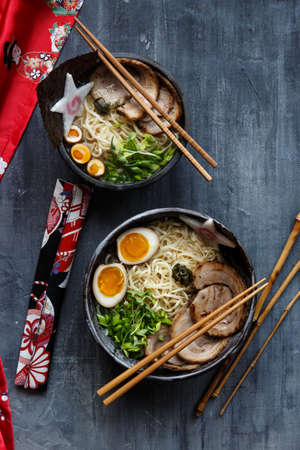 Japanese ramen soup with pork, egg and chivesの写真素材