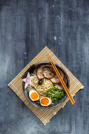 Miso ramen bowl with chasu, egg, daikon, copyspaceの写真素材