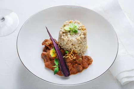 Stewed chicken hearts with barleyの写真素材