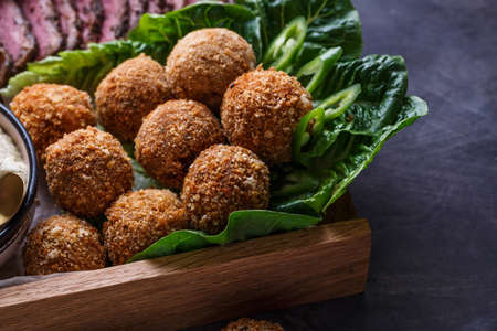 Falafel balls on a romano leafs in a wooden boxの写真素材