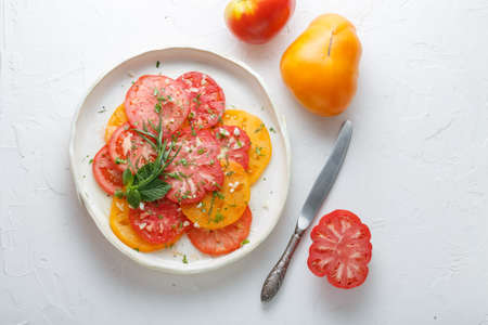 Tomato sliced on a plate. Top viewの写真素材