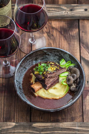 Slowly stewed beef short ribs with potato, mushroom and gravy.の写真素材