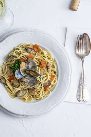 Seafood pasta with clams Spaghetti alle Vongole on white background