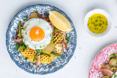 Sunny side egg, potato and jamon ham, Spain breakfast, top viewの写真素材