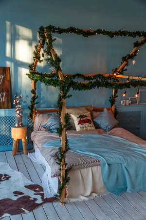 Loft with Christmas decoration and the bed.の写真素材