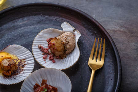 Grilled scallops shell with puree, close view, restaurant dish