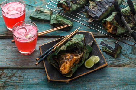 Grilled stingray wing or sambal stingray in leaf with lime and spicy dressing, malaysian cuisineの写真素材