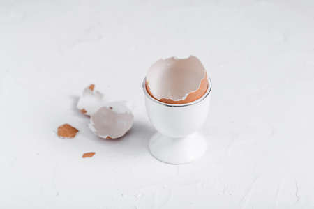 Empty eg shell or eaten eg on white background. copy space