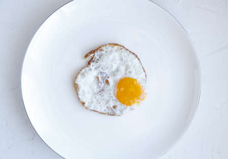 Fried egg isolated on white background, top view
