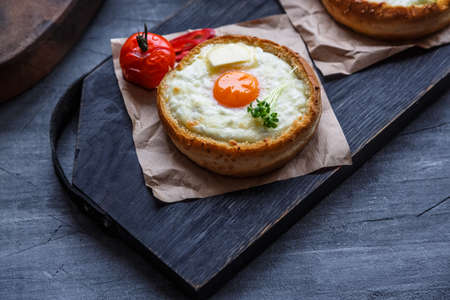 Breakfast with baked cheese and egg yolk filled buns