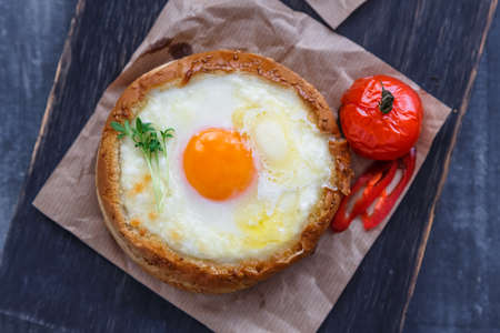 Breakfast with baked cheese and egg yolk filled bunsの写真素材