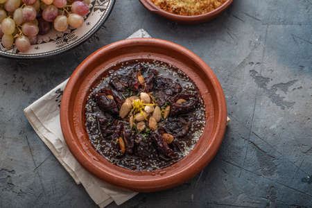 Slow cooked beef tajine with dates, raisins and almonds - moroccan cuisine, copy spaceの写真素材