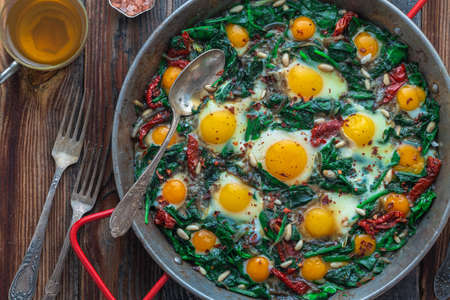 Close view of spinach and fried eggs.の写真素材