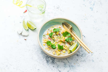 Scallops crudo in asian style with mango and pineapple in coconut milk, copy spaceの写真素材