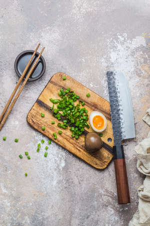 Japanese marinated egg on wooden board, copy spaceの写真素材