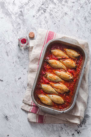 Baked stuffed squid with tomato sauce, copy spaceの写真素材