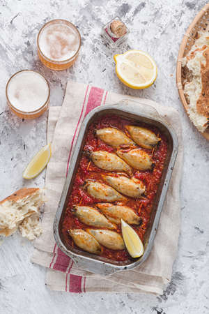 Baked stuffed calamari with tomato sauce, copy spaceの写真素材