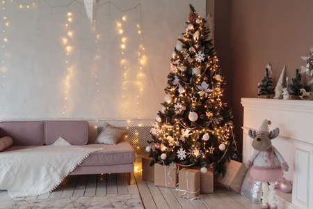Winter home decor. Christmas tree in loft interior. Old vintage furnitureの写真素材
